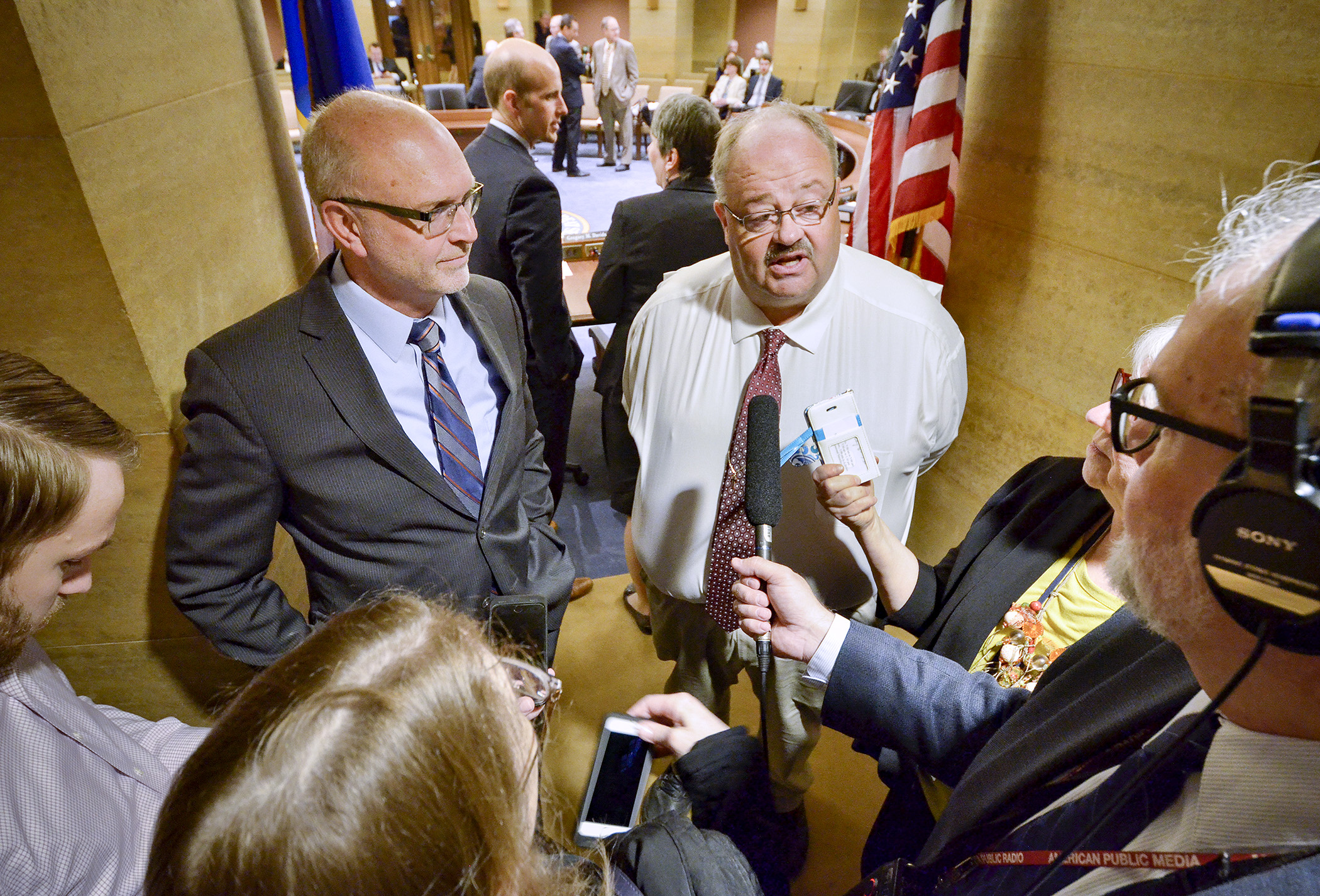 Sen. Roger Chamberlain, left, and Rep. Greg Davids take questions from the media after adopting the conference report on the omnibus taxes bill Tuesday morning. Chamberlain and Davids chair the respective tax committees. Photo by Andrew VonBank